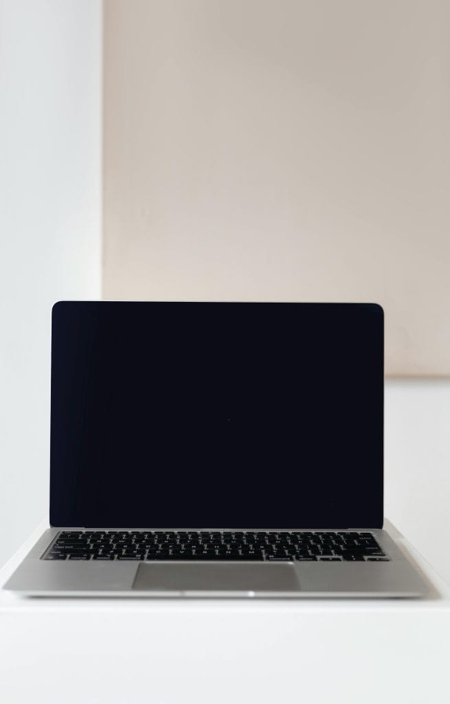 Modern laptop with a blank screen for mockup use in a soft indoor setting.